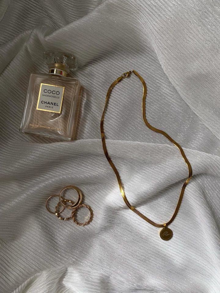 Stainless steel surfer snake necklace with a wave charm palm charm