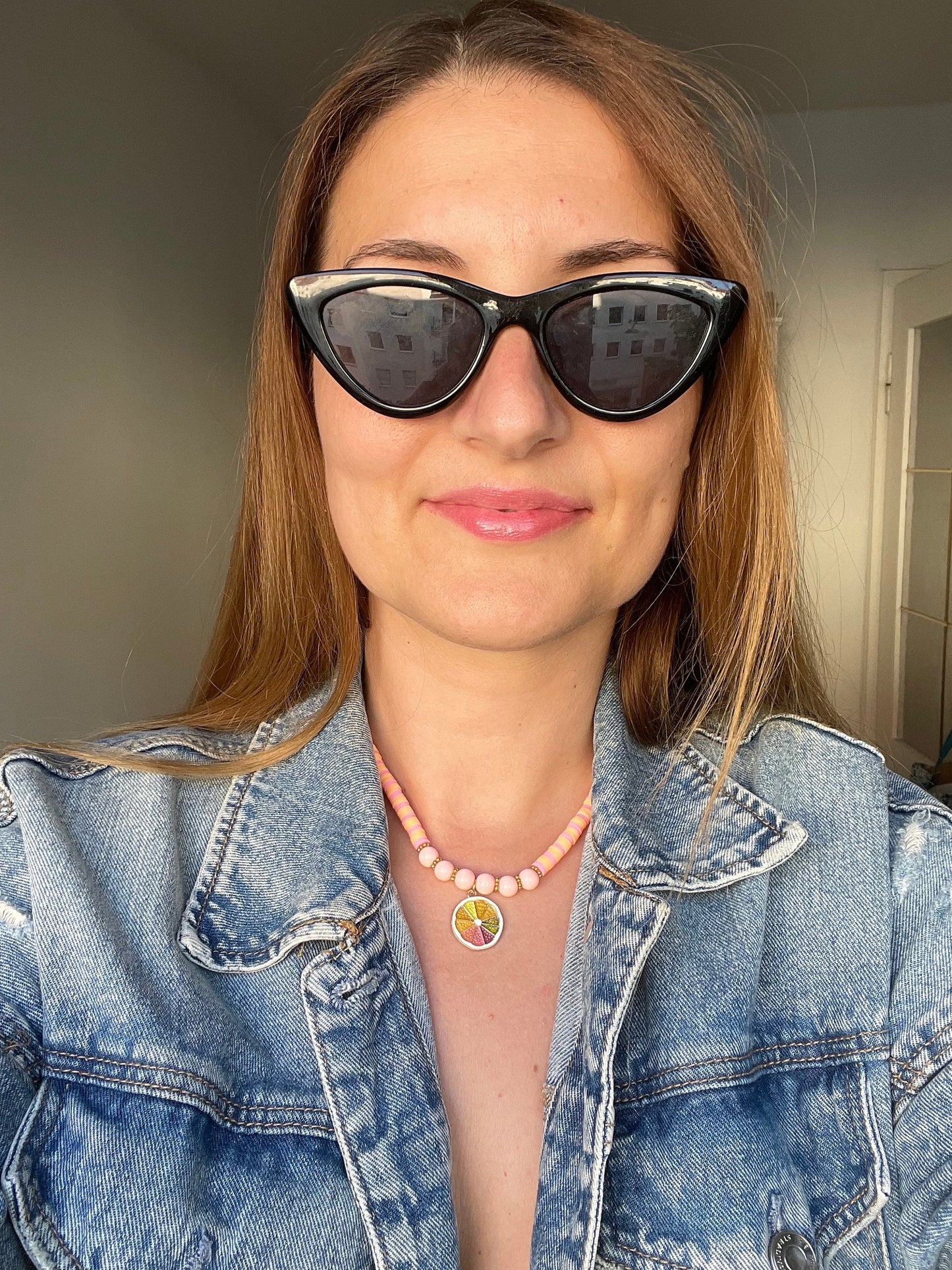 Colorful citrus beaded necklace with a charm