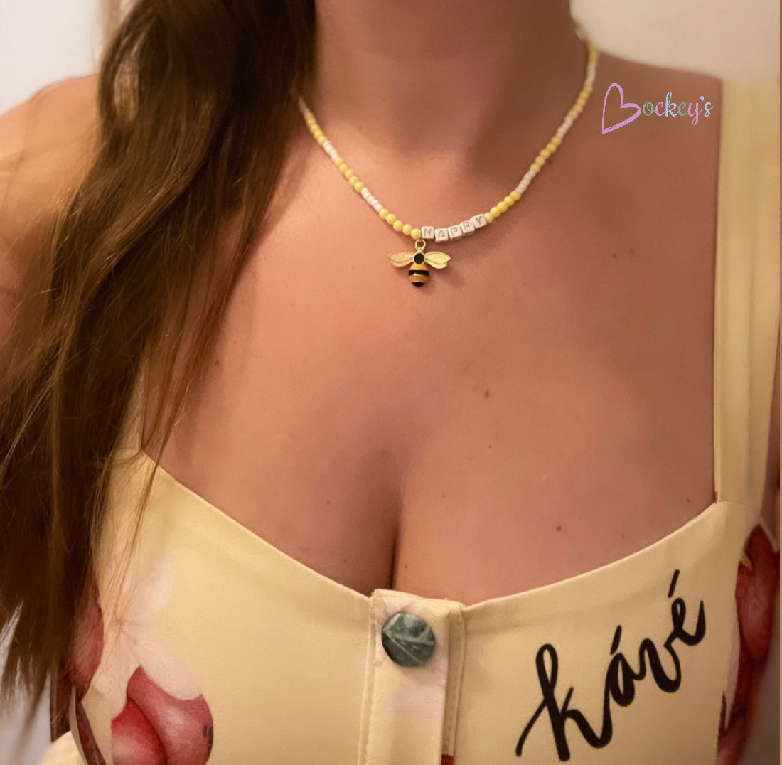 Yellow be(e) happy necklace, beaded letter necklace with a charm