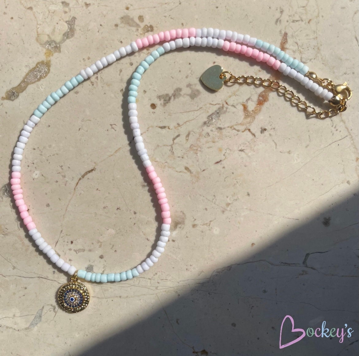 Ombre thin beaded necklace in pastel colors and evil eye charm
