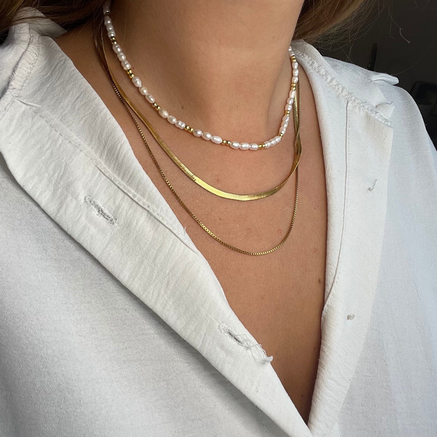 Classy freshwater pearls and gold-plated beads necklace with a stainless steel necklace set