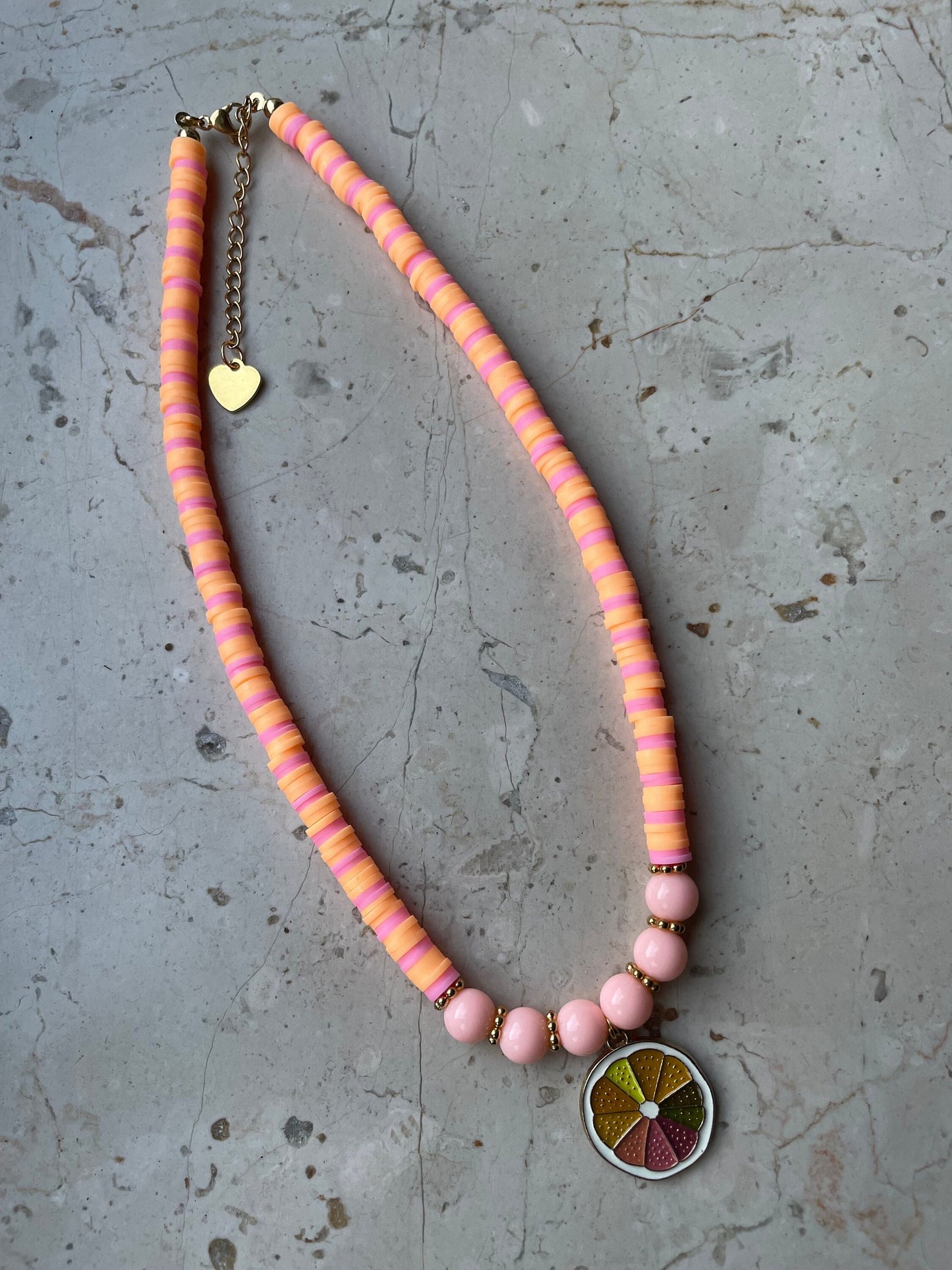 Colorful citrus beaded necklace with a charm