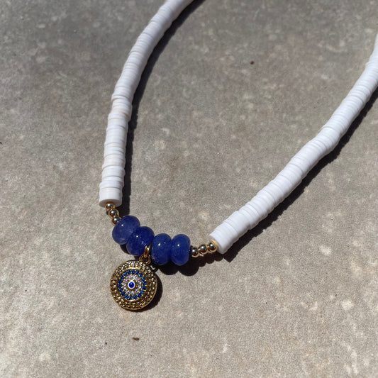 White blue evil eye necklace with a charm perfect for summer