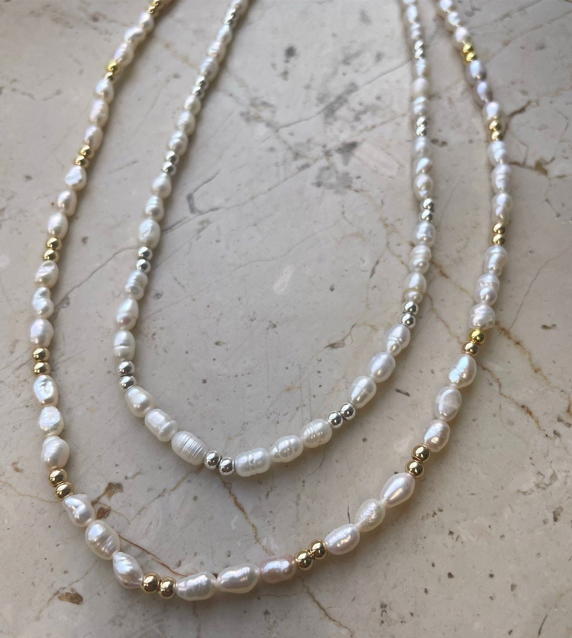 Classy freshwater pearls and gold-plated beads necklace with a stainless steel necklace set