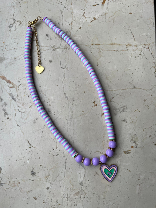 Purple beaded necklace with a heart charm